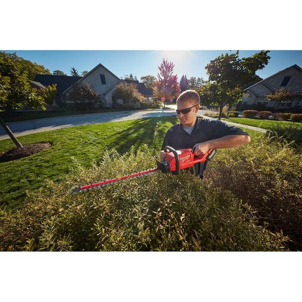 M18 FUEL 18V Lithium-Ion Brushless Cordless Hammer Drill & Impact Driver Combo Kit w/M18 FUEL 24 in. Hedge Trimmer
